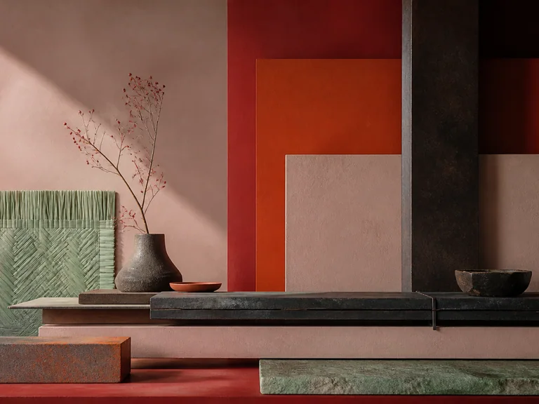 Measured stone, iron, and woven-grass slabs in fawn, scarlet, orange red, and pale green.